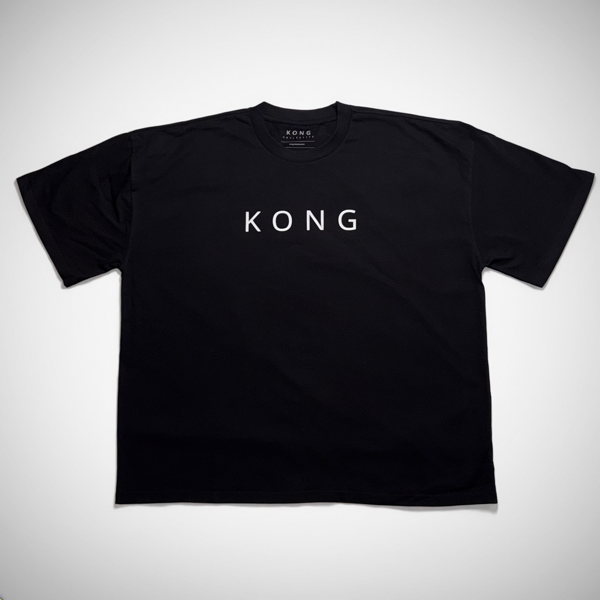 KONG Collective Origin Tee in black, front view with small KONG chest logo